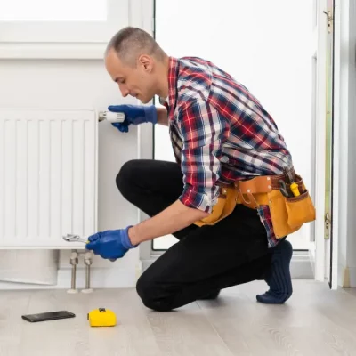 close-up-of-a-young-male-plumber-installing-radiat-2025-01-10-03-24-28-utc.webp
